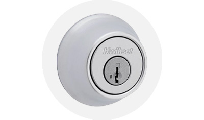 Kwikset Residential Deadbolt product isolated on top of a gray circle